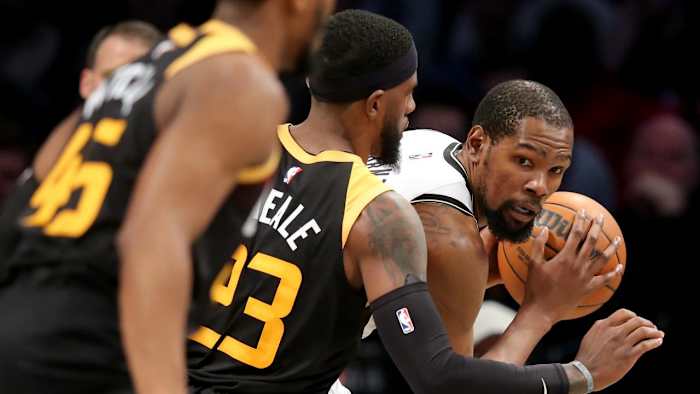 Mar 21, 2022; Brooklyn, New York, USA; Brooklyn Nets forward Kevin Durant (7) controls the ball against Utah Jazz forward Royce O'Neale (23) during the fourth quarter at Barclays Center. Mandatory Credit: Brad Penner-USA TODAY Sports